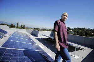 man and Solar panels
