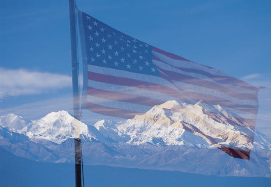 united states flag overlay snow covered mountains